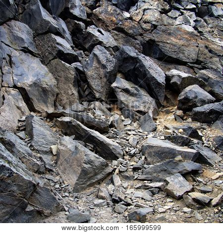 The bottom of a jagged hill at the Big Obsidian Flow in the Newberry National Volcanic Monument in Central Oregon.