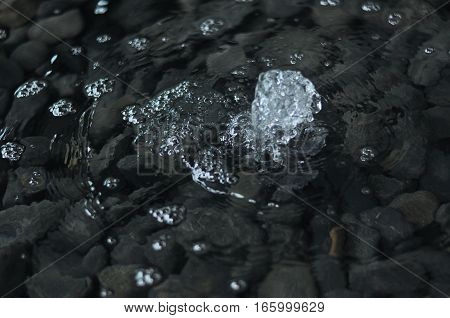 Water Spout 3. Architecture reflective pool with pebbles