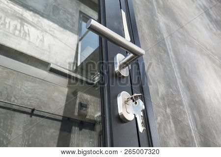 Metalic Door Knob With Lock On A Door. Horizontal