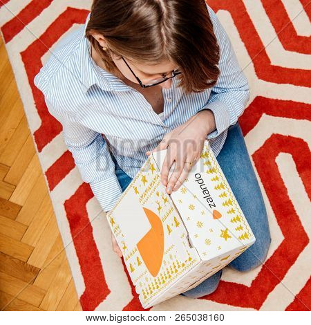 Paris, France - Jan 5, 2018: Overhead View From Above Of Curious Fashionable Woman Opening The Cardb