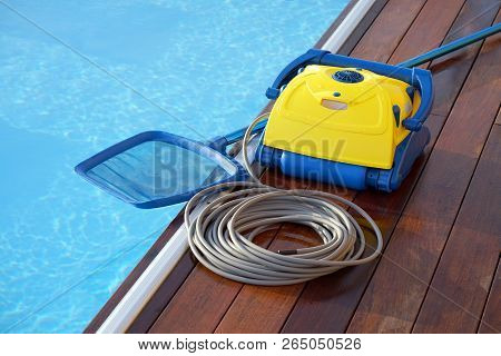 Pool Cleaner During His Work. Cleaning Robot For Cleaning The Botton Of Swimming Pools.