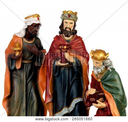 The three wise men. Ceramic figures isolated on white background