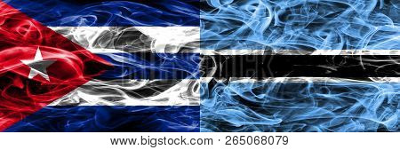 Cuba, Cuban Vs Botswana, Botswanan Smoke Flags Placed Side By Side. Concept And Idea Flags Mix