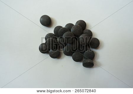 Pills Of Chelated Iron In A Heap From Above