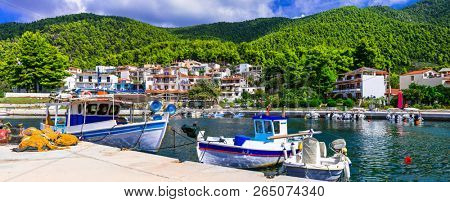 Beautiful gren Skopelos island- traditional fishing village Neo Klima, northen Sporades of Greece