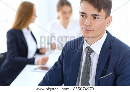 Group Of Business People Or Lawyers Discussing Terms Of Transaction In Office. Focus At Young Busine