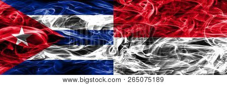 Cuba, Cuban Vs Monaco, Monacan Smoke Flags Placed Side By Side. Concept And Idea Flags Mix
