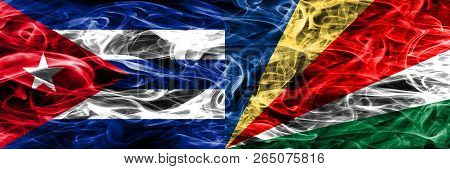 Cuba, Cuban Vs Seychelles, Seychelloise Smoke Flags Placed Side By Side. Concept And Idea Flags Mix