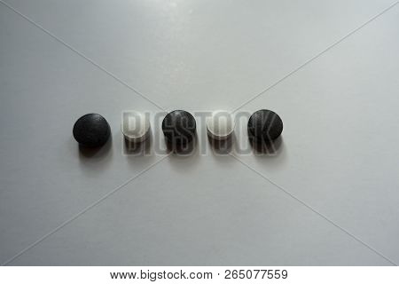 Line Of Black And White Round Pills