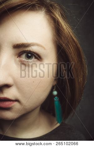 Half Face Of Stylish Girl With Turquoise Earrings In Vintage Style.