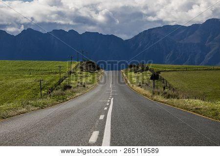 Road Through Agricultural Fields With Mountain Range In The Distance - Somerset West, Western Cape, 