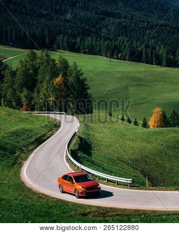 Funes Valley, Italy - October 5, 2017: Adventure Trip By Car On Mountain Road Against Alpine Green M
