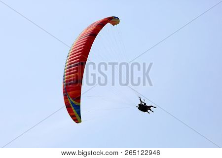 Paraglider Flying On A Wing In The Sky