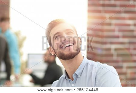 Cheerful man smiling  in office.