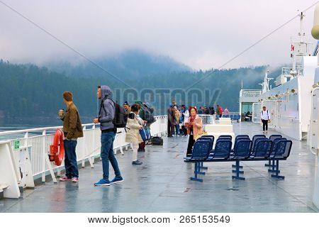 October 8, 2018 In Swartz Bay, Bc:  Passengers Wondering Around The Observation Deck On The Bc Ferri