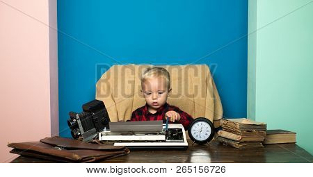 Boy Typewrite Special Report On Vintage Typewriter. Little Photojournalist Work On Written Report At