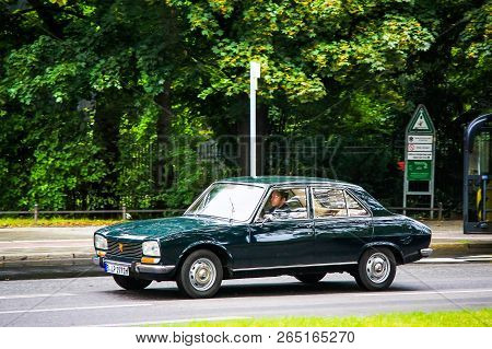 Berlin, Germany - September 10, 2013: Green Retro Car Peugeot 504 In The City Street.