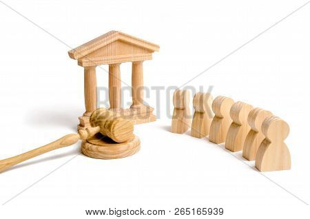 A Group Of People Standing Near The House Of Government And Judge's Gavel. Concept Of The Judicial S