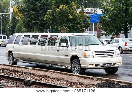 Ufa, Russia - September 18, 2011: White Limousine Cadillac Escalade In The City Street.
