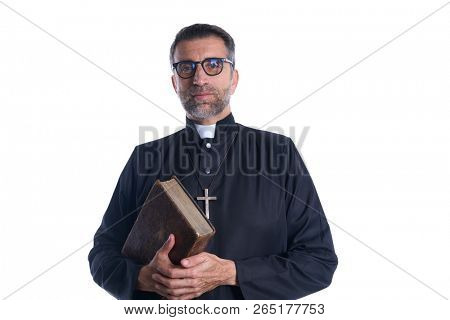 Priest portrait with Holy Bible in hands isolated