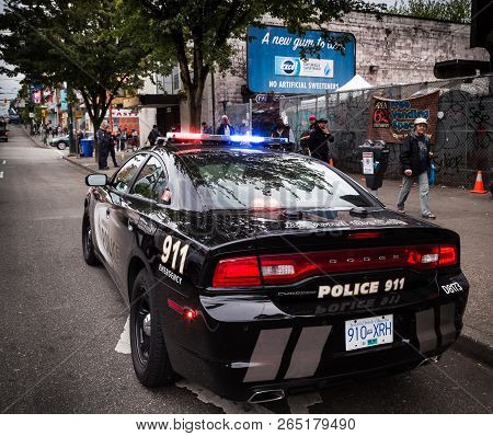 Vancouver, Bc, Canada - May 11, 2016: Vpd Cruiser On Vancouvers Downtown Eastside With Officers In T