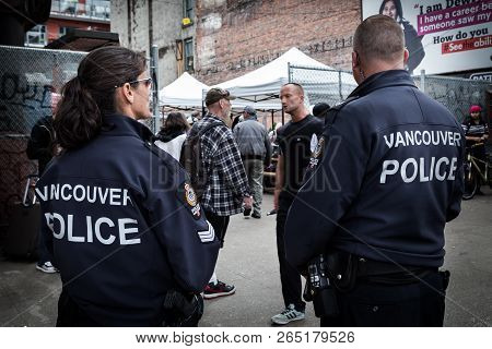 Vancouver, Bc, Canada - May 11, 2016: Vancouver Police Officer On Patrol In An Area Of Heavy Drug Us
