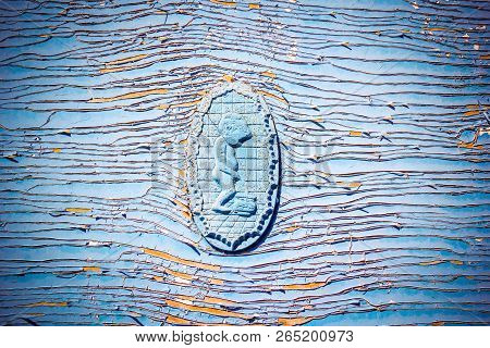 Symbol Pissing Boy, Restroom Sign On Wc / Toilet Door On Old Weathered Wooden Plank Painted In Blue 