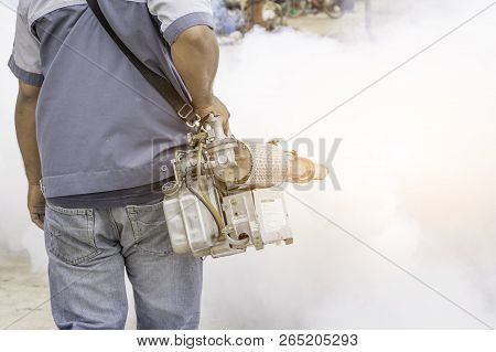Man Spraying Mosquitoes To Get Rid Of Mosquitoes Causing Dengue Fever.