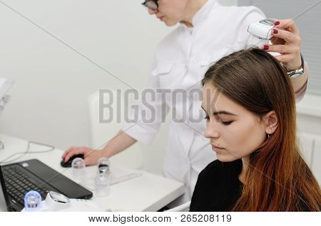 Doctor Examines The Hairy Part Of The Patient's Head