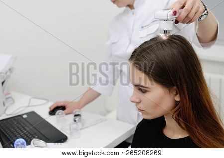 Doctor Examines The Hairy Part Of The Patient's Head