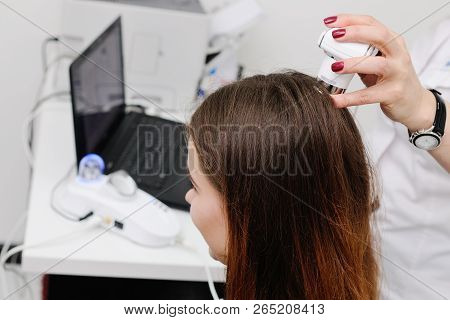 Doctor Examines The Hairy Part Of The Patient's Head