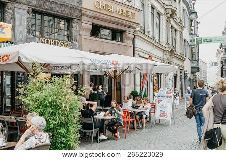 Germany, Leipzig, October 6, 2018: Street Cafe Nordsee. People Eat Seafood And Communicate With Each