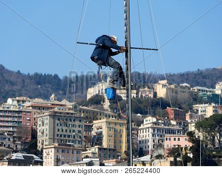 Genoa, Italy, March 25, 2018 - Man Working On A Mast Of A Ship