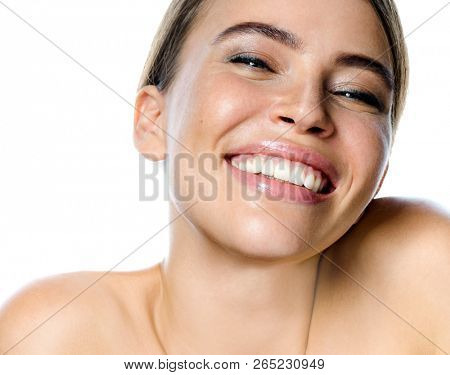 beauty portrait of attractive young caucasian smiling woman brunette isolated on white studio shot  lips toothy smile facer head and shoulders cheerful teeth neck hand looking at camera