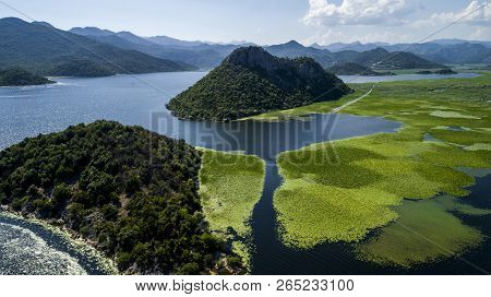 Aerial View Of The Beautiful Landscape Of Lake Skadar In The Mountain On A Sunny Day. Montenegro. Th