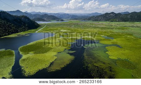 Aerial View Of The Beautiful Landscape Of Lake Skadar In The Mountain On A Sunny Day. Montenegro. Th