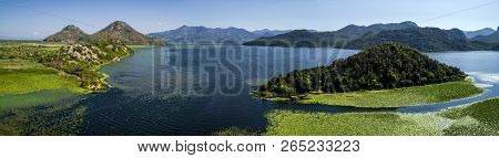 Aerial Panoramic View Of The Beautiful Landscape Of Lake Skadar In The Mountain On A Sunny Day. Mont