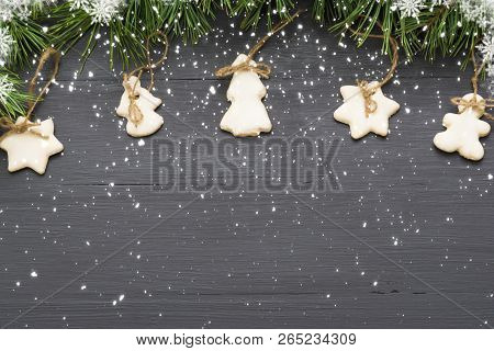 Christmas Garland With Sugar Glazed Cookies, Natural Fir Tree Branches And On Dark Background With C