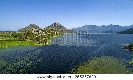 Aerial View Of The Beautiful Landscape Of Lake Skadar In The Mountain On A Sunny Day. Montenegro. Th