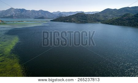 Aerial View Of The Beautiful Landscape Of Lake Skadar In The Mountain On A Sunny Day. Montenegro. Th