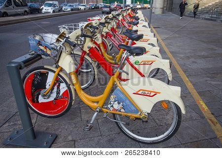 Milan, Italy, November 11, 2017 - Bike Sharing Service Racks In Milan. The Yellow Bikemi Bicycles Ar