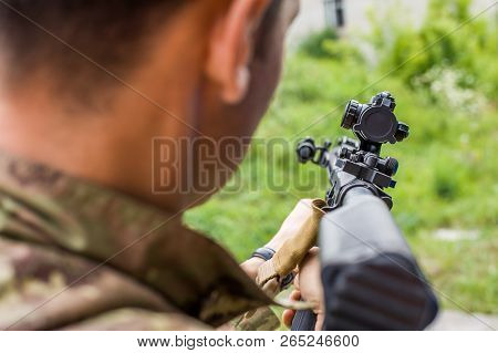 Military Man With Automatic Rifle And Rifle Scope