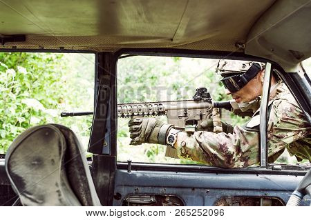 Military Man With Automatic Rifle And Rifle Scope
