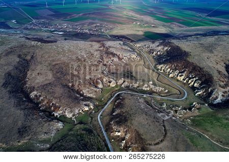mountain landscape with some of the oldest limestone rock formations in Europe in Dobrogea Gorges (Cheile Dobrogei) Romania - aerial view
