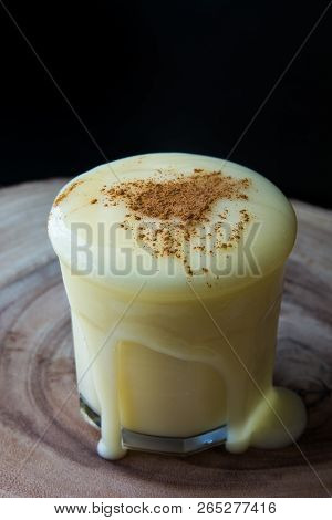 Boza Or Bosa Drink Flows From A Glass With Cinnamon