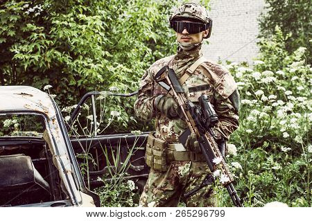 Military Man With Automatic Rifle And Rifle Scope