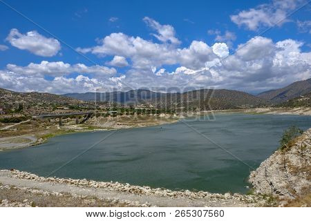 Germasogeia Dam Landscape View On A Bright Blue Sky Day In Early Summer.