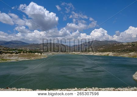 Germasogeia Dam Landscape View On A Bright Blue Sky Day In Early Summer.
