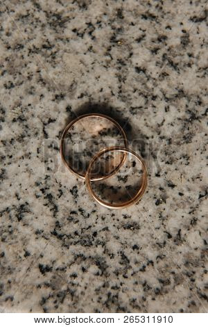 Wedding Rings On Table. Gold Rings With Diamond On Sun. Wedding Accsessories. Macro