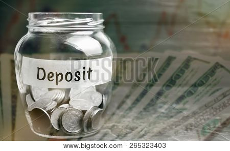 Glass Jar With Coins And The Inscription 